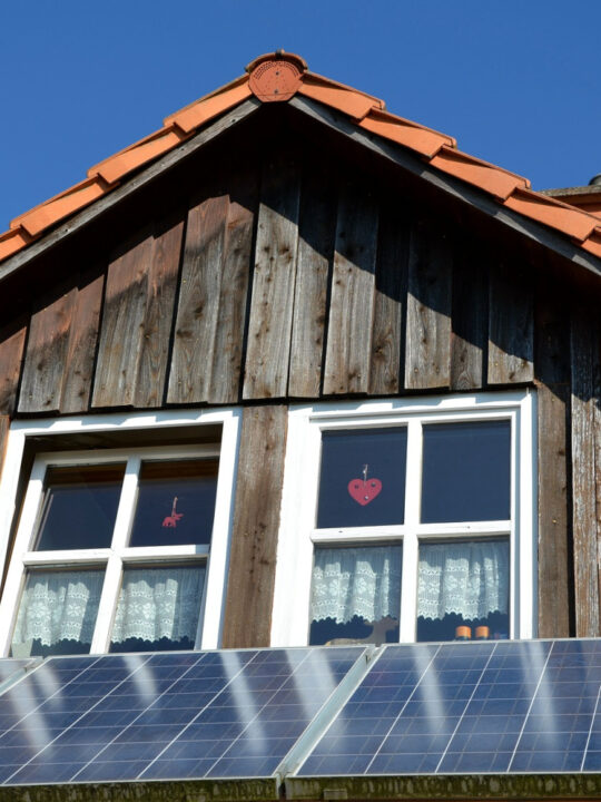 solor panels on a roof are one way to power your home for less