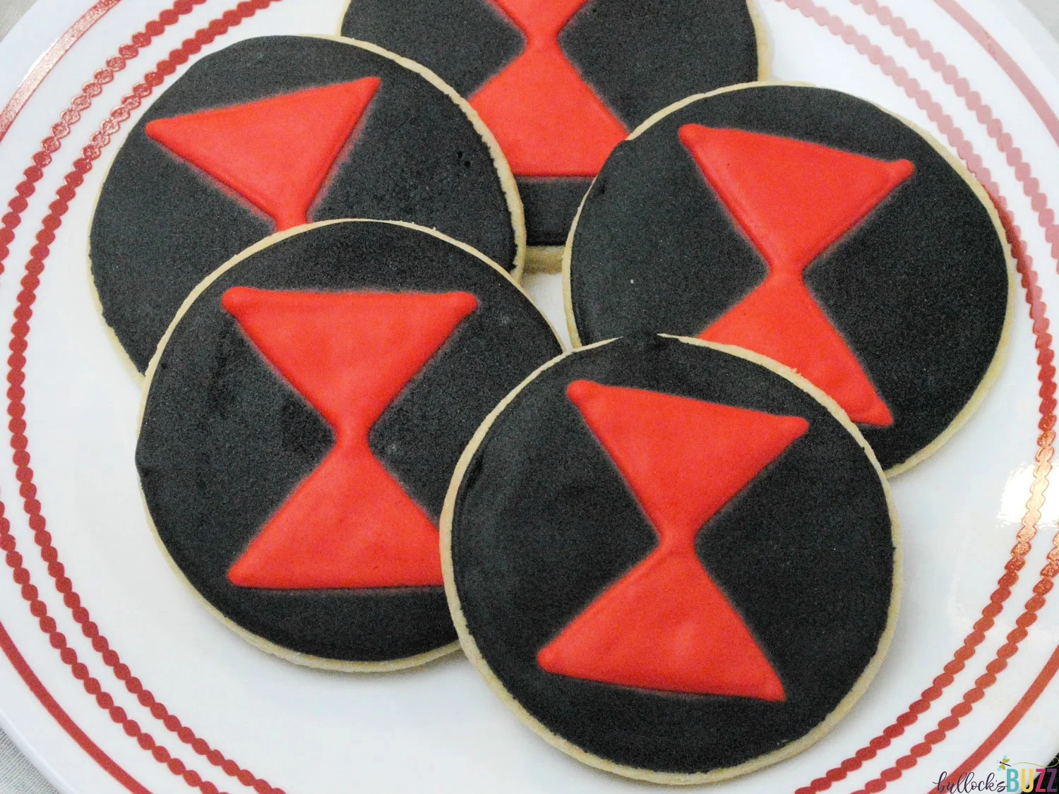 black widow cookies on white plate