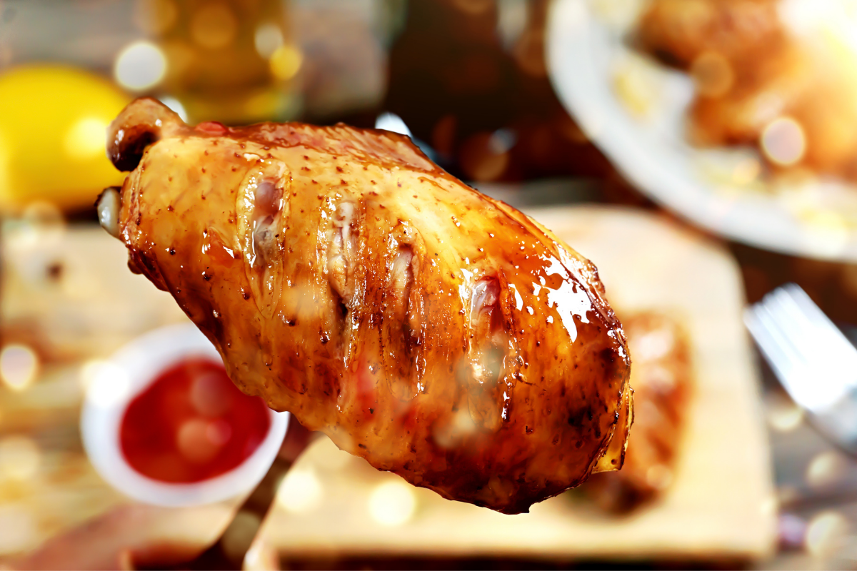 chicken wing on fork