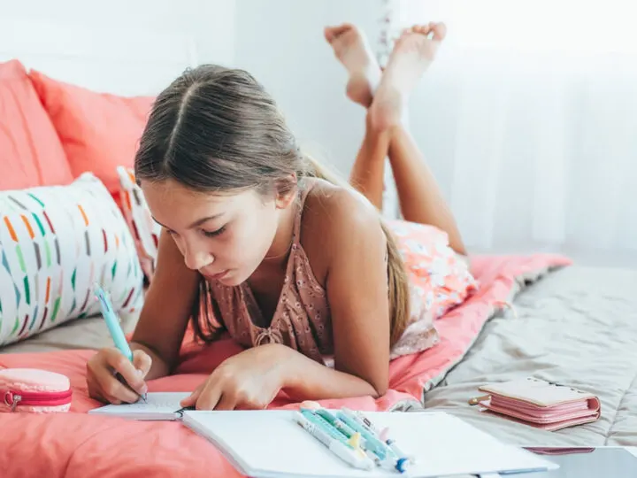 a child journaling as one of the 5 Crafts for Kids That Allow Self Expression