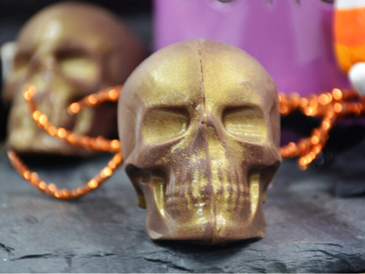 close up of gold skull hot cocoa bombs for Halloween