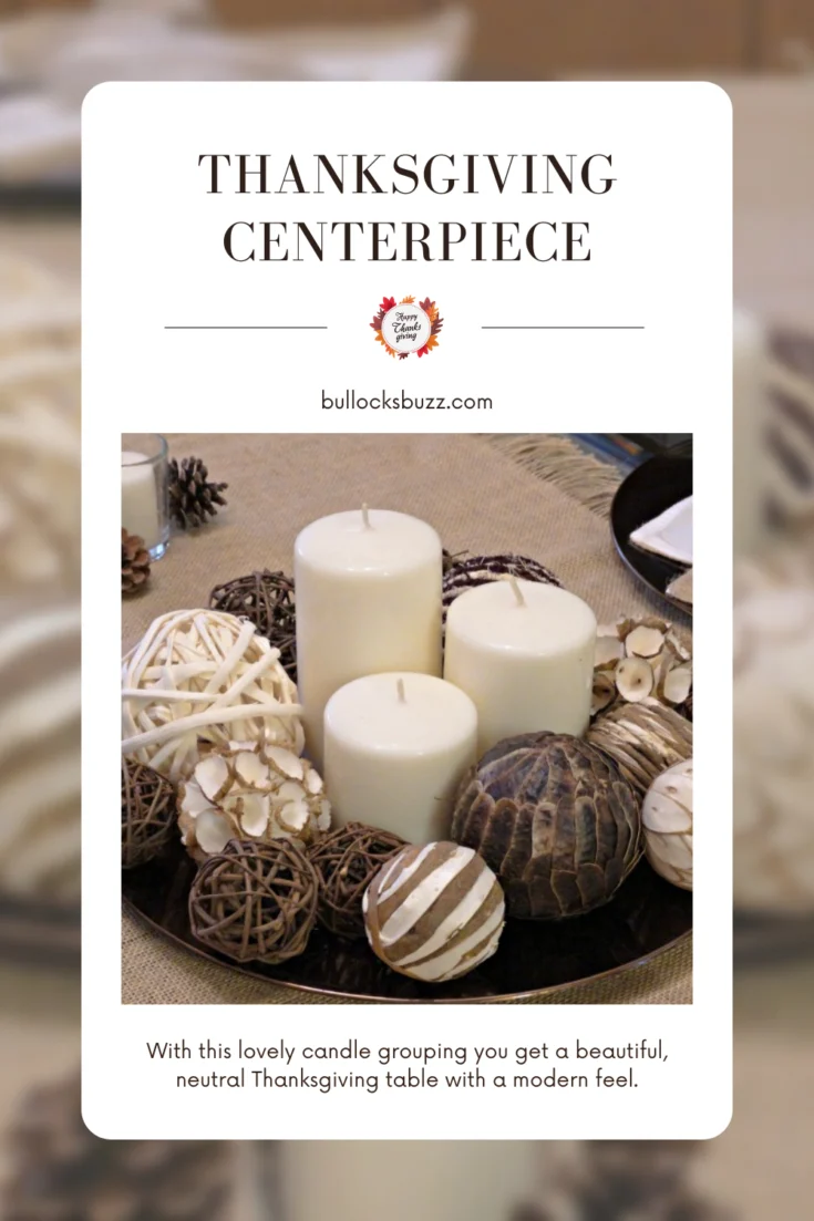 pillar candles surrounded by decorative wicker balls to create a simple DIY Thanksgiving centerpiece