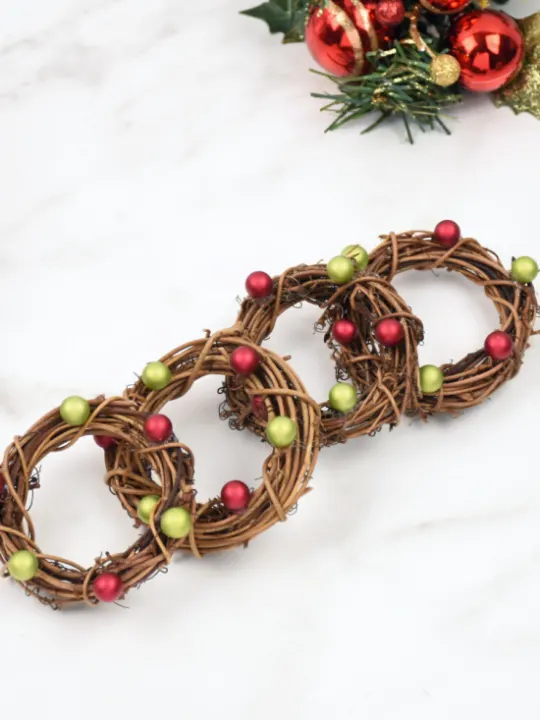 easy DIY Napkin Rings for Christmas laying in a row