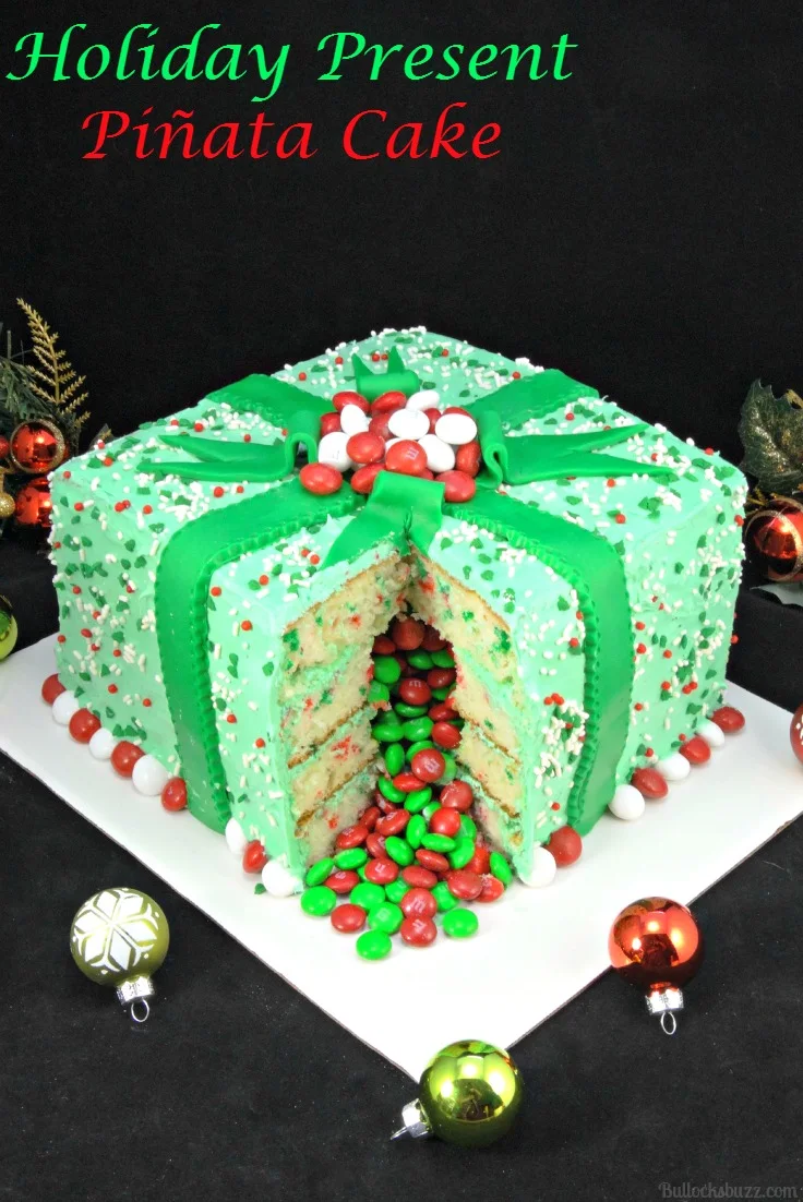 Christmas gift box cake with M&Ms spilling out of the middle