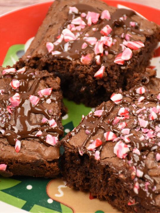 close up of chocolate peppermint brownies on a holiday plate