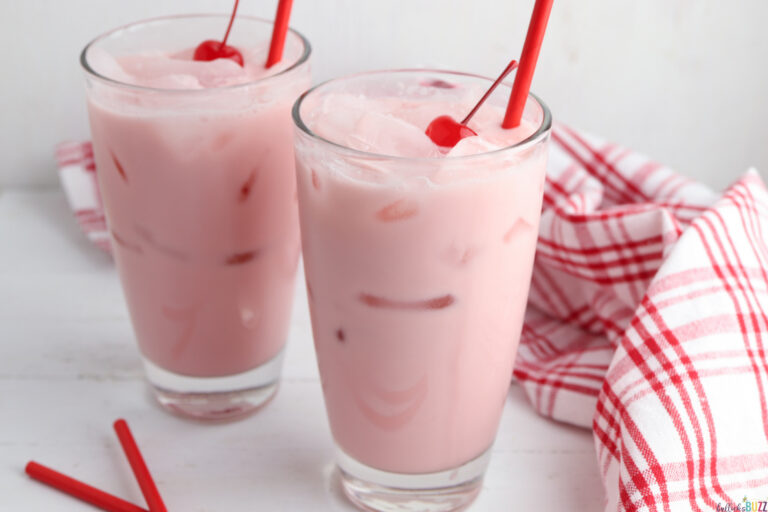 cherry cream soda garnished with cherries and a straw