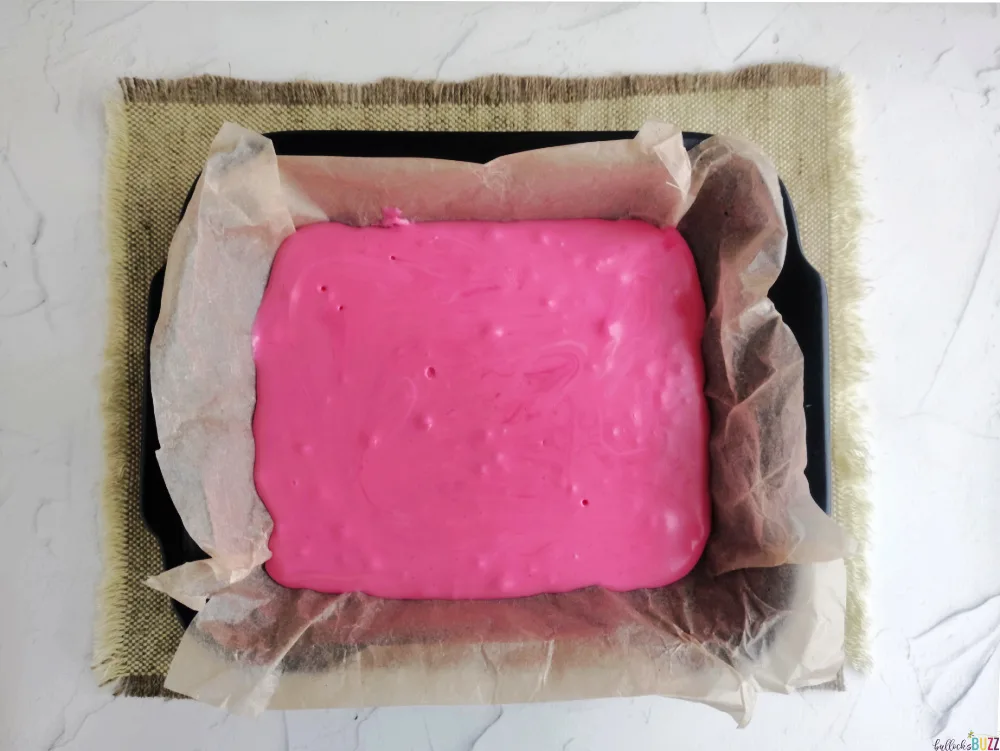 spread pink fudge in prepared pan