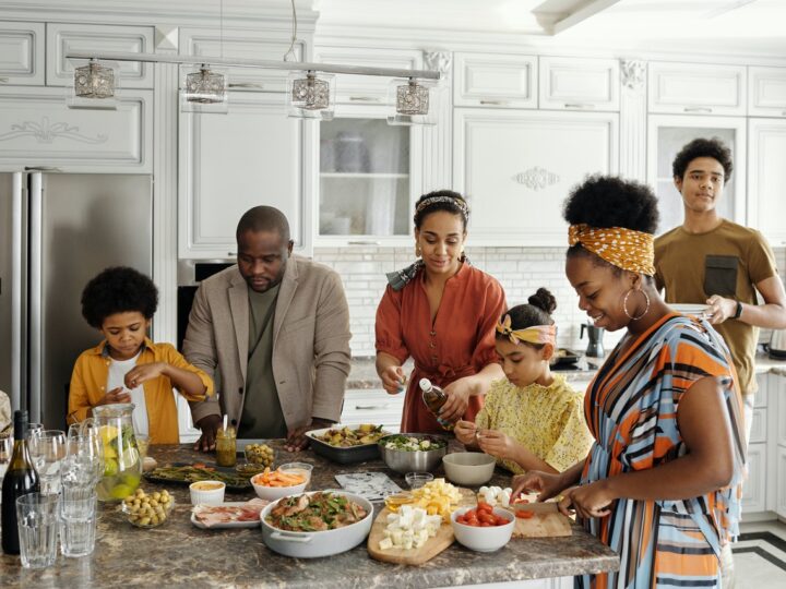 family gathered in kitchen together