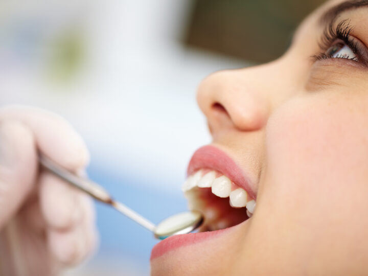 dentist working in a woman's mouth