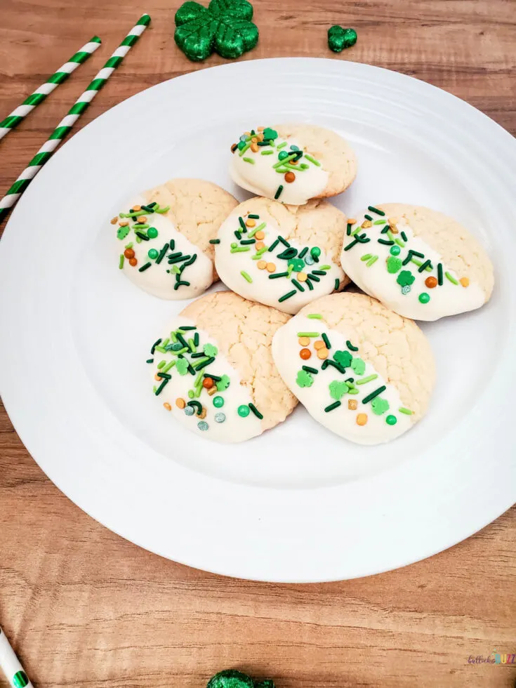 white cake mix cookie son plate decorated for St Patrick's Day