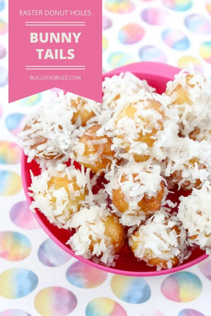 Easter Bunny Tails in a pink bowl on a background decorated with pastel Easter eggs.