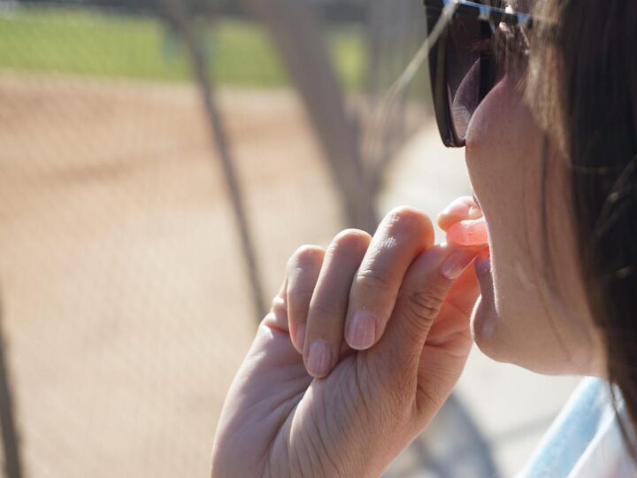 woman eating cbd gummies