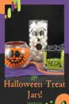 DIY Halloween Treat Jars filled with candy and sitting on Halloween colored fabric.