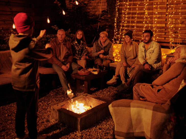 friends sitting around the fire as a way to elevate game nights