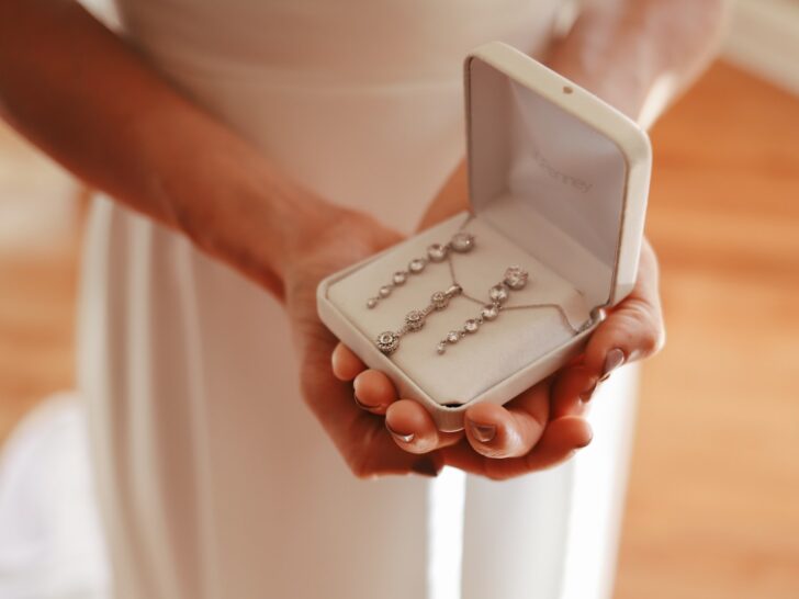 woman holding box of the perfect jewelry for your wedding day