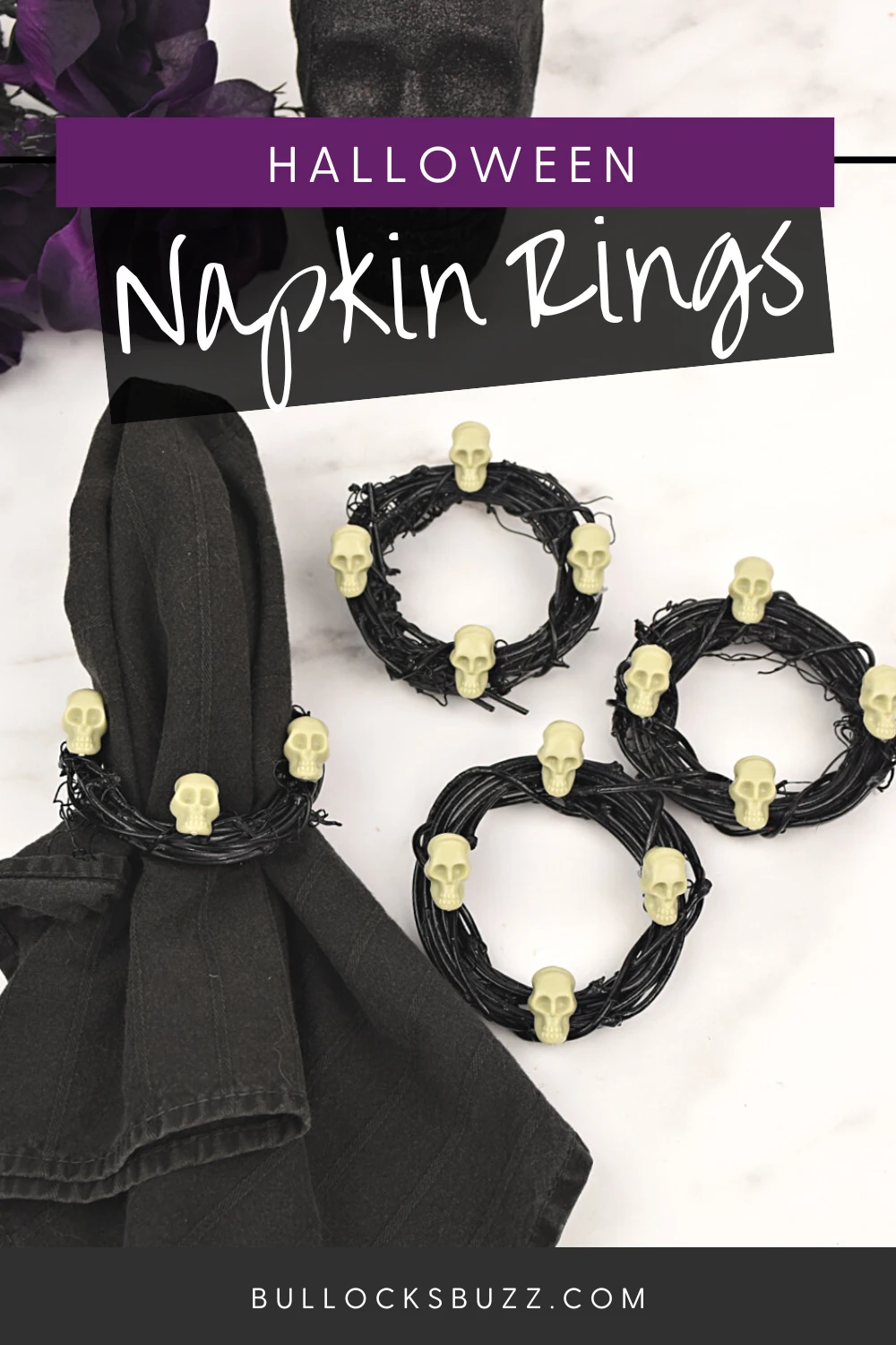 Halloween napkin rings next to a ring on a black napkin