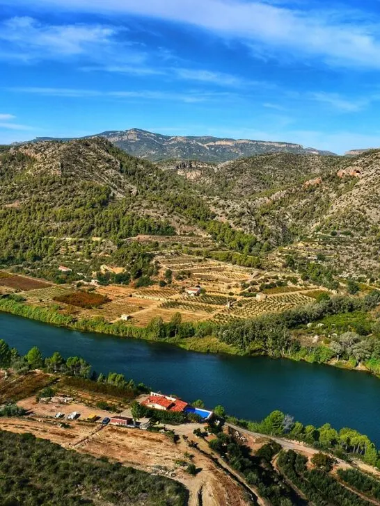 a farm next to a river with all the essentials to live off the grid