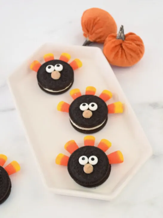 a tray of Oreo Turkeys on a table surrounded by more of the easy Thanksgiving Treats