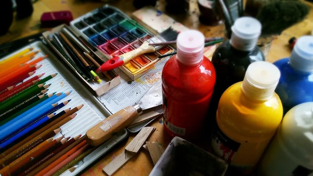 colored pencils, paint and other art materials