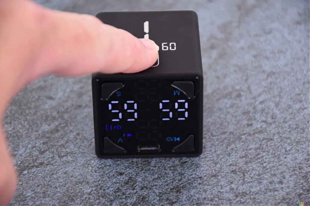 long pressing the fingerprint icon to set the timer to the smaller number facing up