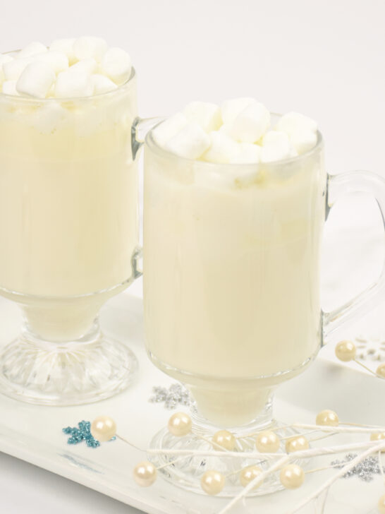 two cups of white hot chocolate topped with marshmallows