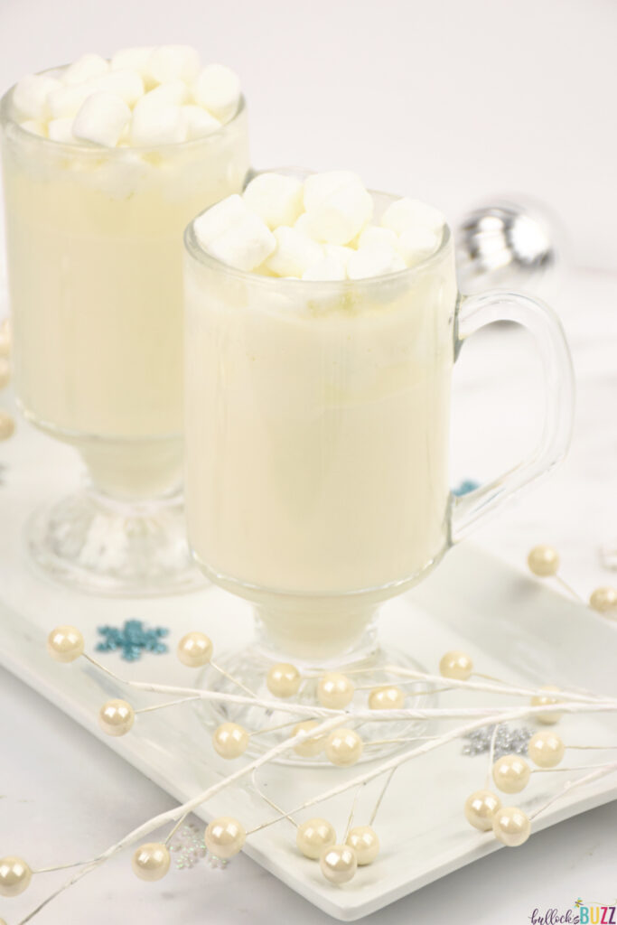 white hot chocolate in glasses topped with marshmallows