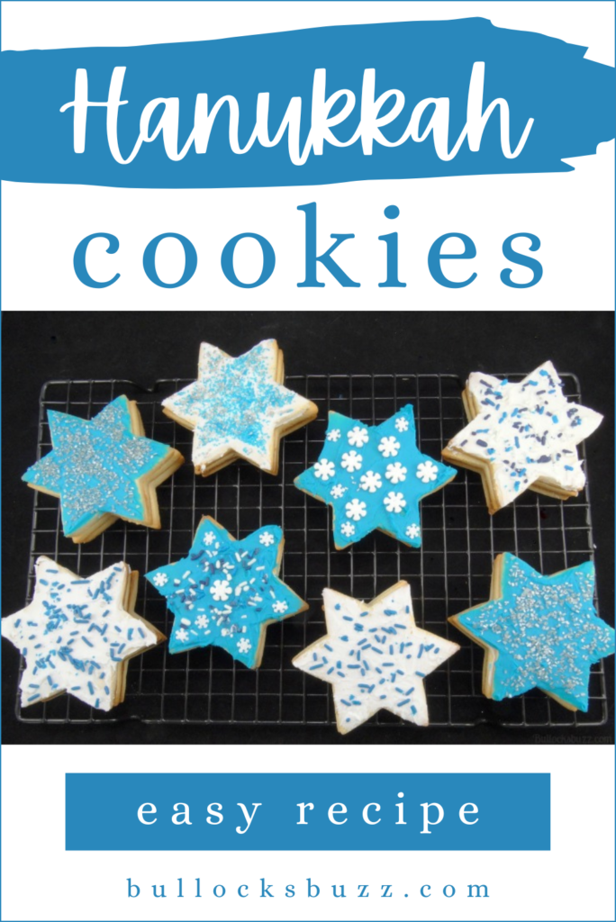 blue and white decorated Star of David Hanukkah Piñata Cookies on a rack