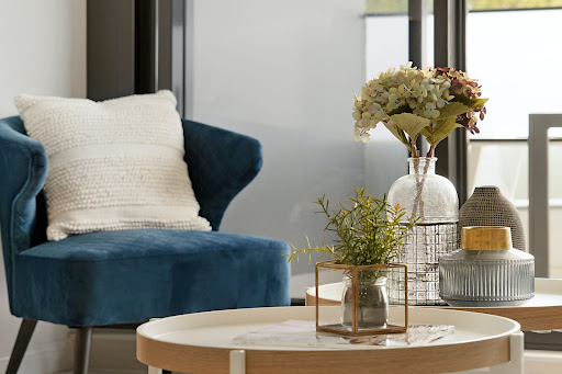 accent table in front of blue chair