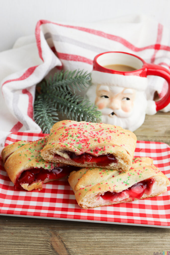 cherry cheesecake Danish on a plate in front of a Santa mug