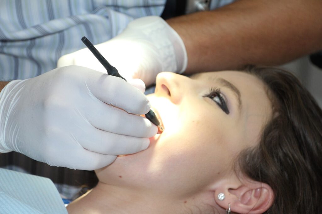 a woman at the dentist getting one of the most common dental procedures 