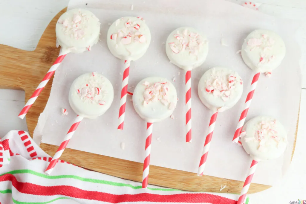 sprinkle white chocolate covered Oreo pops with crushed peppermint