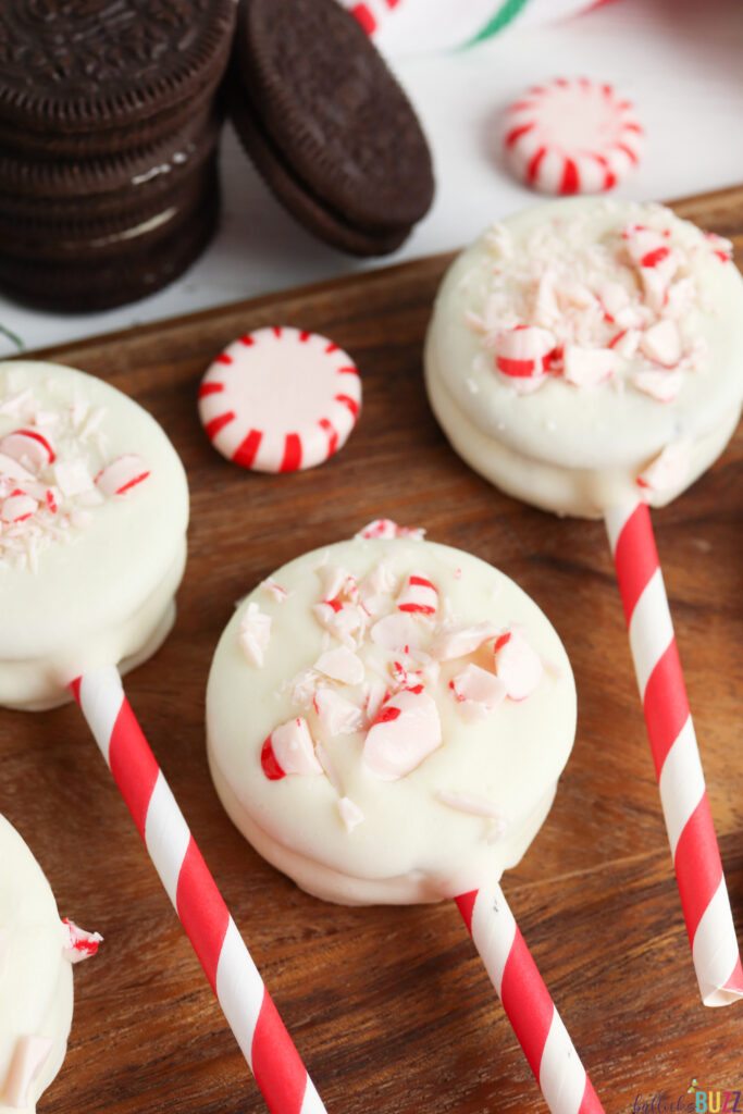 close up of peppermint on white chocolate covered cookies
