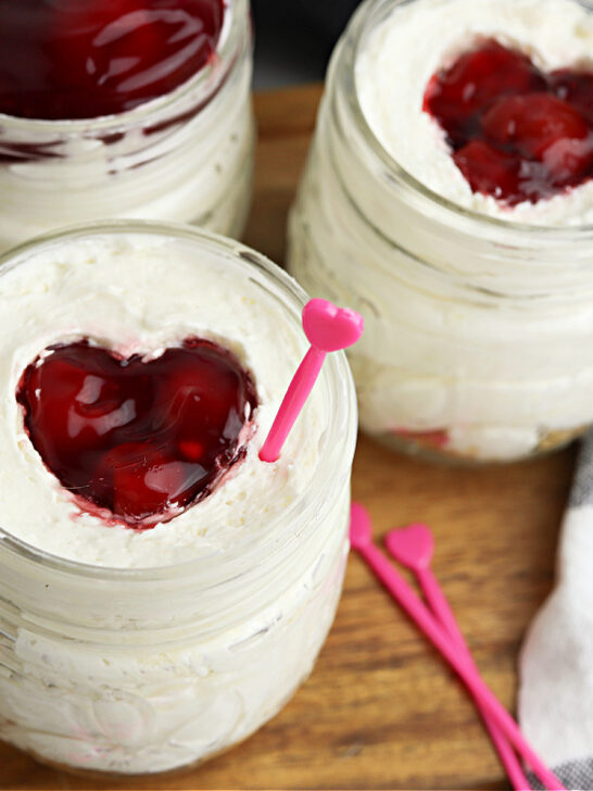 cherry cheesecake jars on cutting board