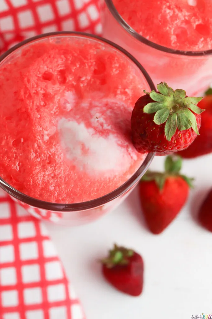 overhead picture of strawberry float with a fresh strawberry garnish on side of glass