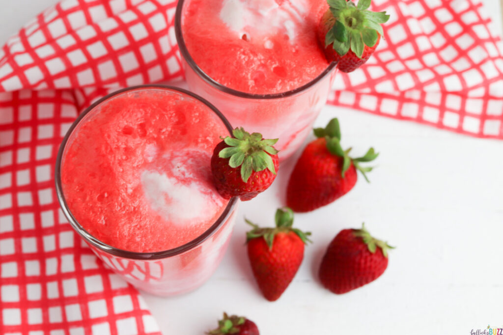 two glasses filled with strawberry ice cream float