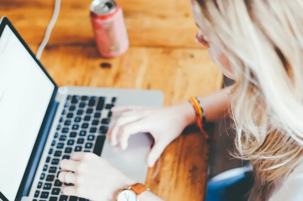 student working on laptop to become a more productive student 