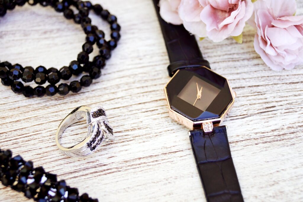 an elegant black watch with a silver and black ring are the type of jewelry for every occasion