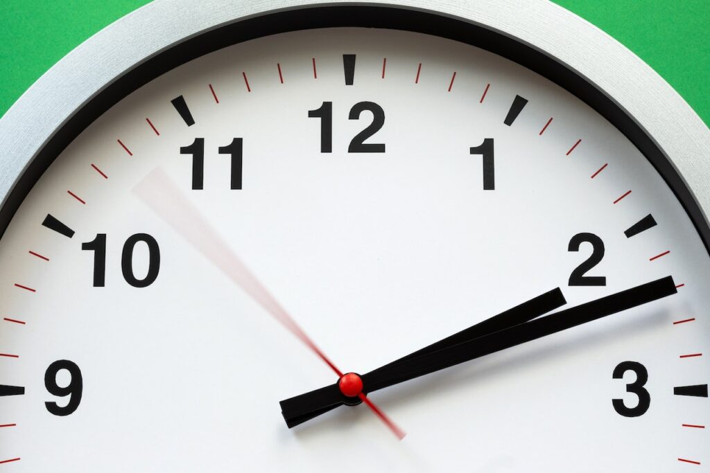 close up of large clock face and ways to manage your time effectively