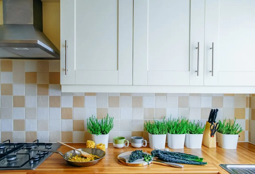 changing out countertops like these butcher block ones is another of the easiest kitchen updates you can make