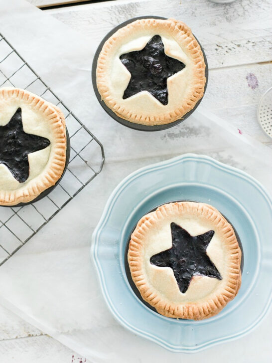 easy mini blueberry pies recipe with stars cut out of the crust