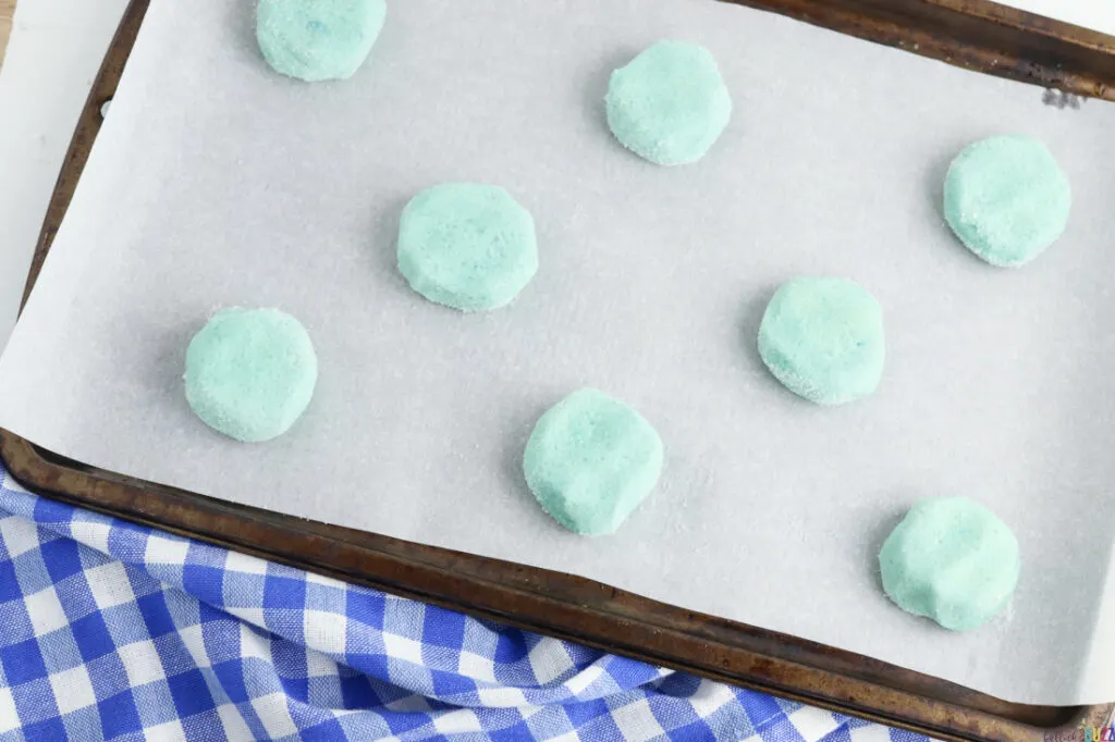 flatten dough balls and place on sheet to bake