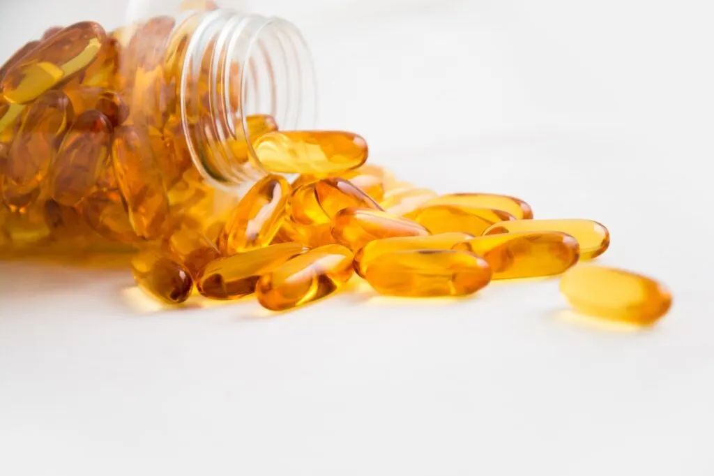 supplements like Turkesterone and Ecdysterone supplements spilling out of a bottle