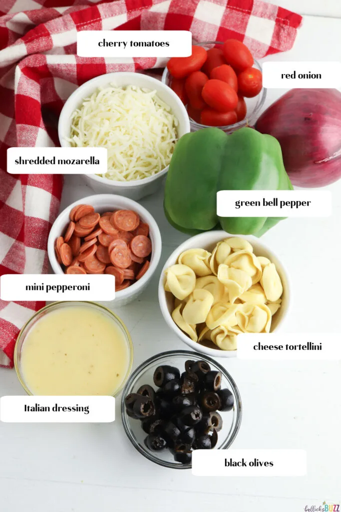ingredients in bowls to make tortellini pasta salad