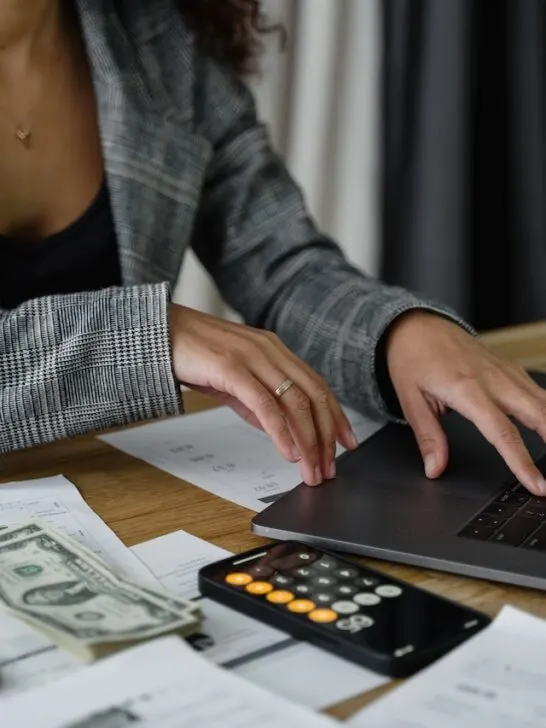 woman working on computer to make a budget for college