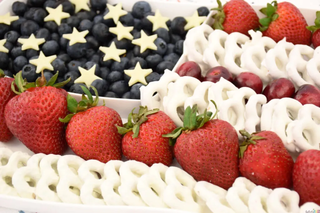 red, white and blue fruit on a flag-shaped tray to make a fourth of July fruit tray 