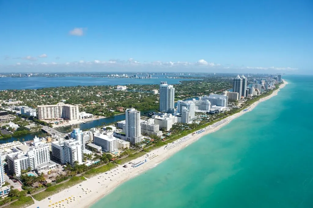 ariel view of a Florida city on the beach showing the beauty of the state and why so many people consider moving to Florida