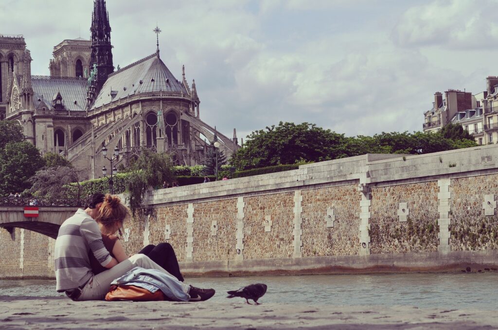 couple holding each other while on their romantic Paris getaway