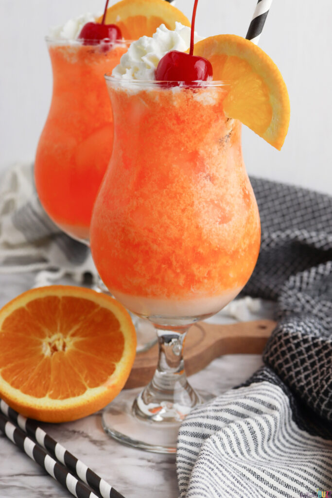 hurricane glass filled with a frosty Orange Creamsicle mocktail