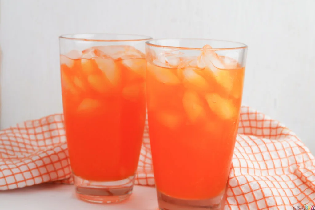 add orange soda to glasses filled with ice
