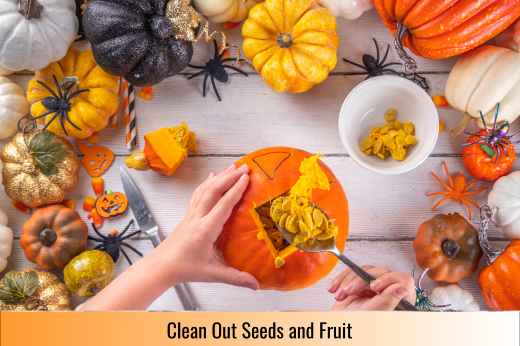 Scooping out the seeds and flesh from inside the pumpkin